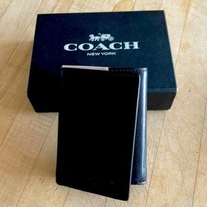 Brand new, never used genuine Coach men’s black leather wallet with original box